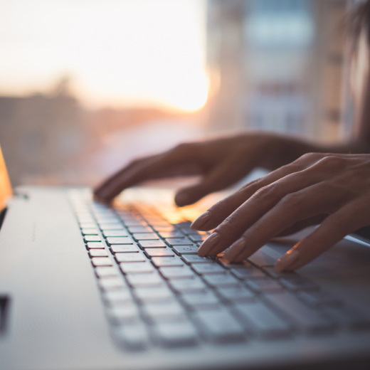 fingers on computer keyboard