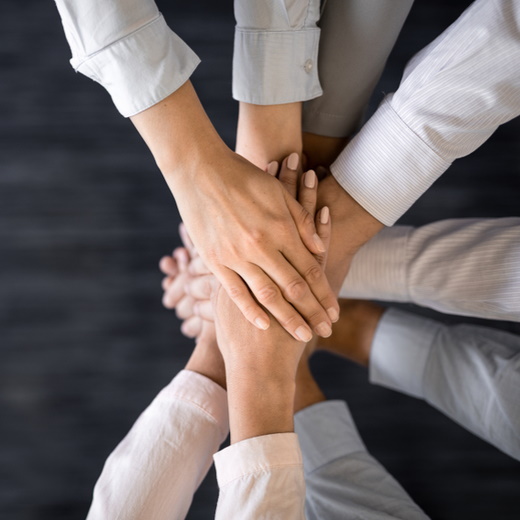 leaders hands clasped together